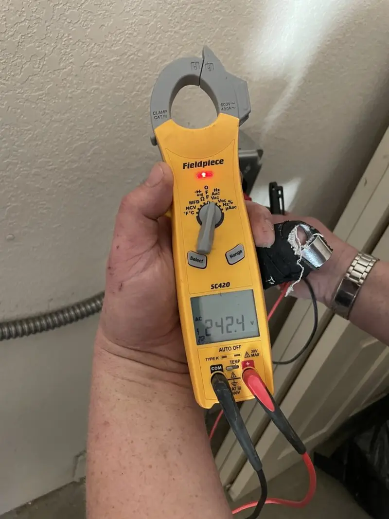Voltage testing with clamp meter during Outlet Installation in Wellford